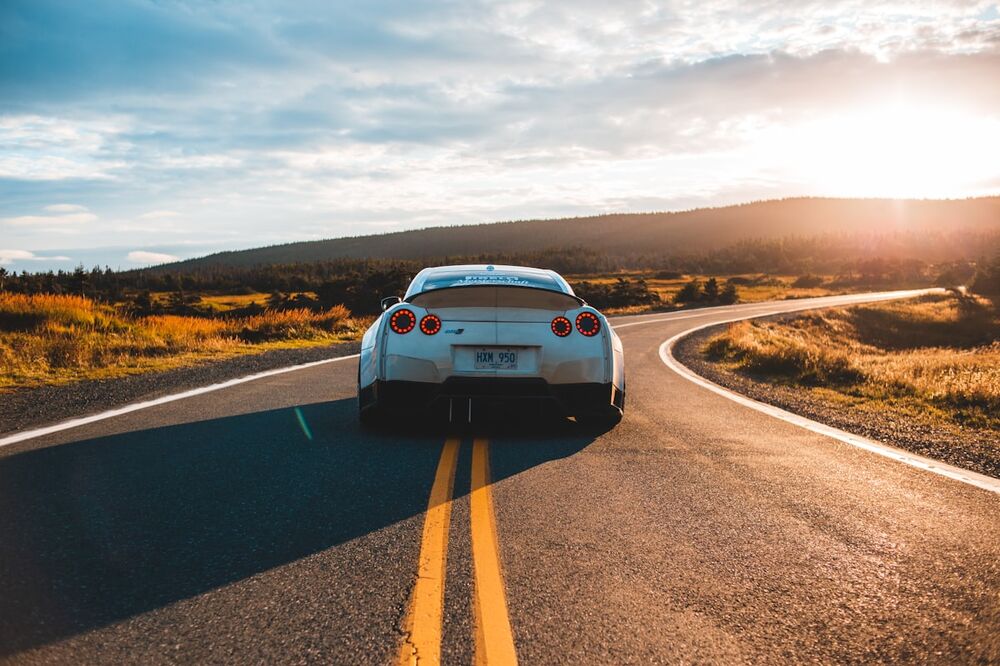 Car driving away on an open road