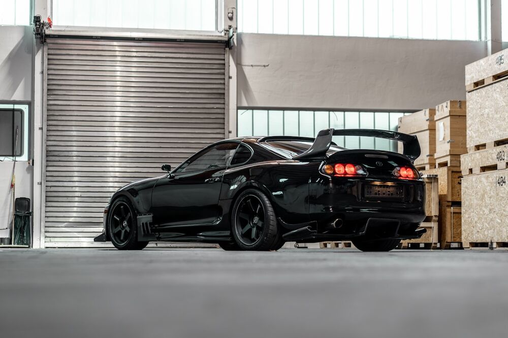 Sports car parked inside the workshop bay